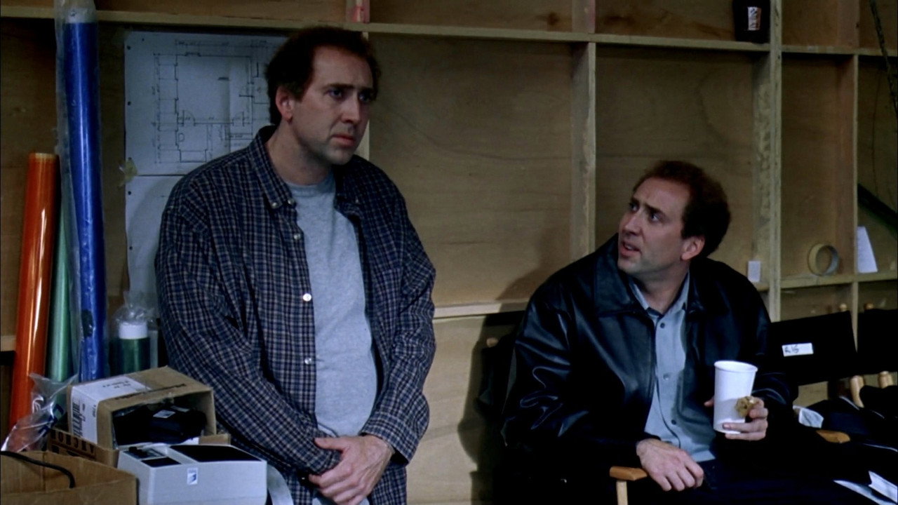 The two Kaufman brothers together on a film set, one standing, one seated with coffee