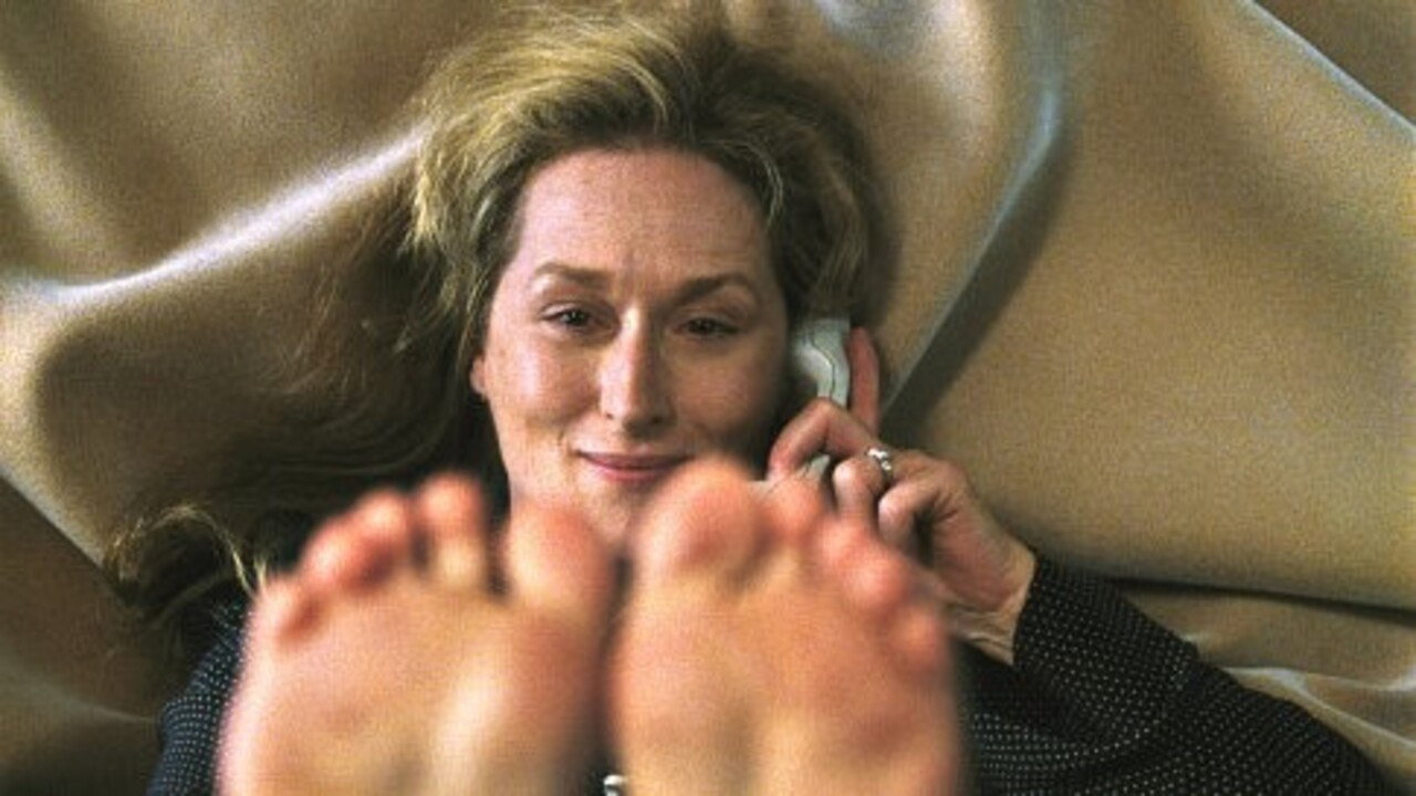 Susan Orlean smiling on the telephone
