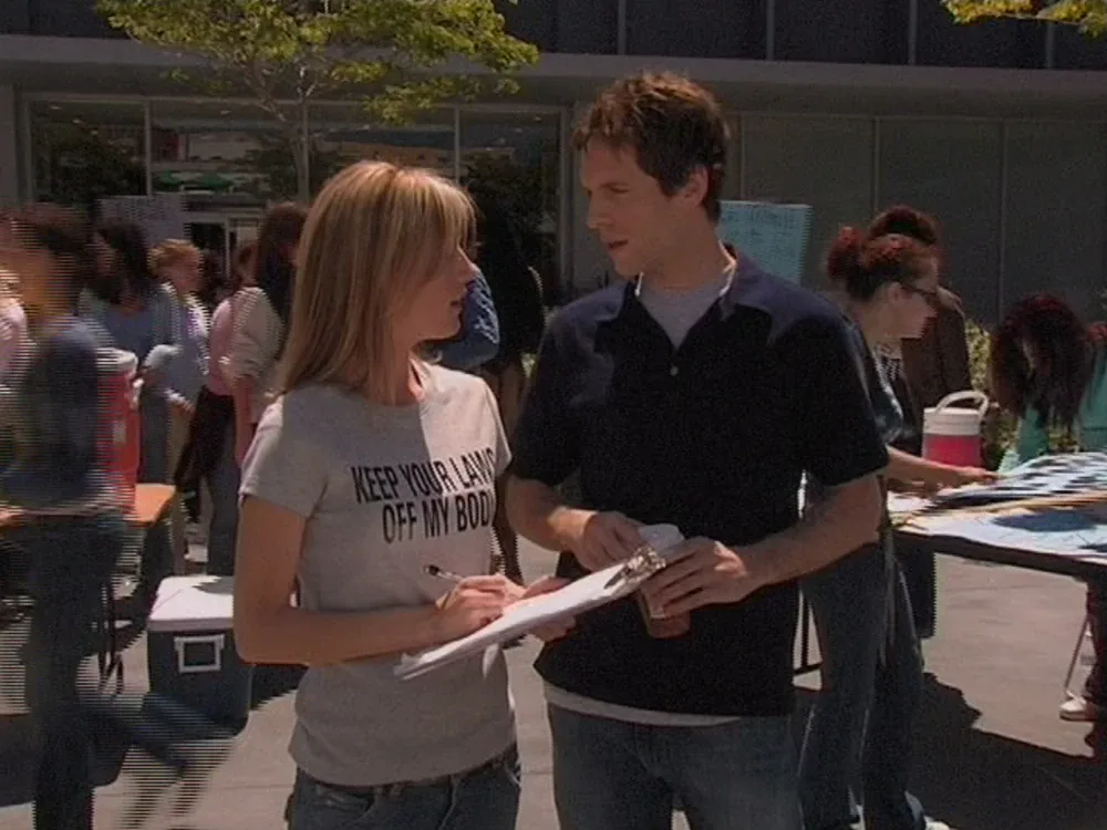 Still from It's Always Sunny S01E02: Dennis works the pro-choice side