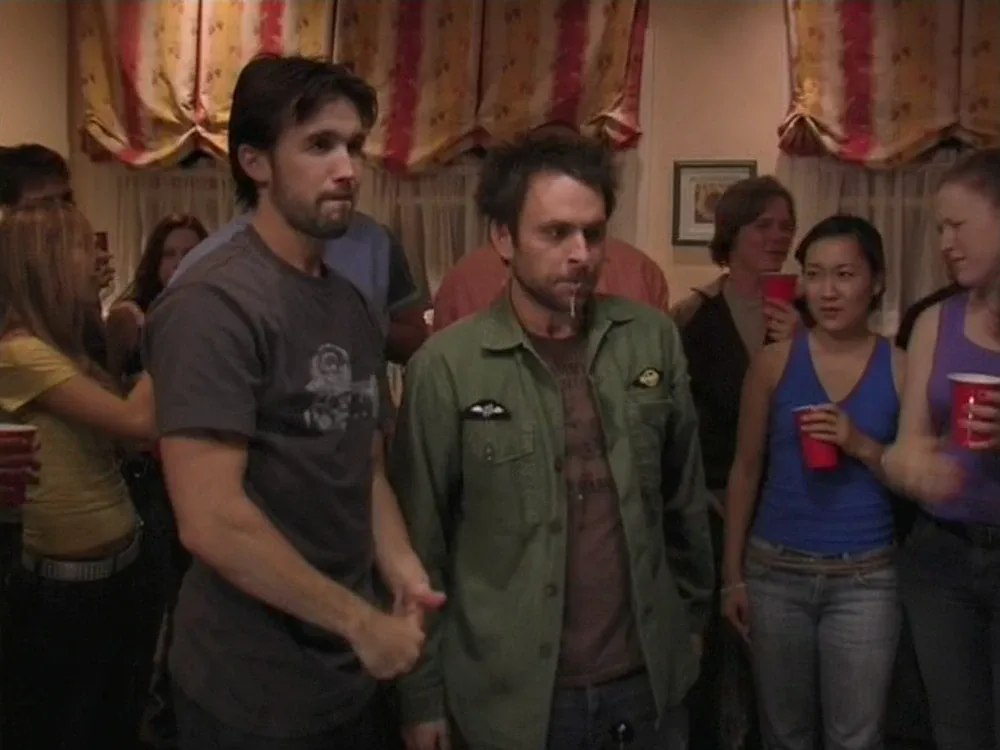 Still from It's Always Sunny S01E03: Charlie and Mac at the party