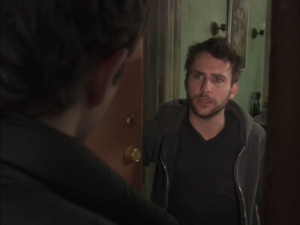 Still from It's Always Sunny S01E04: Charlie, mid fake-cancer scheme