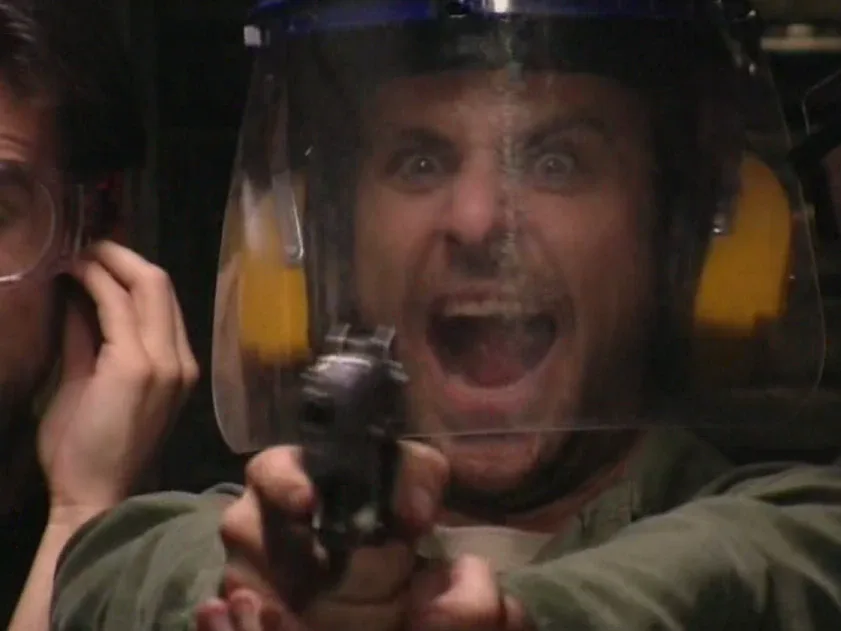 Still from It's Always Sunny S01E05: Charlie shoots