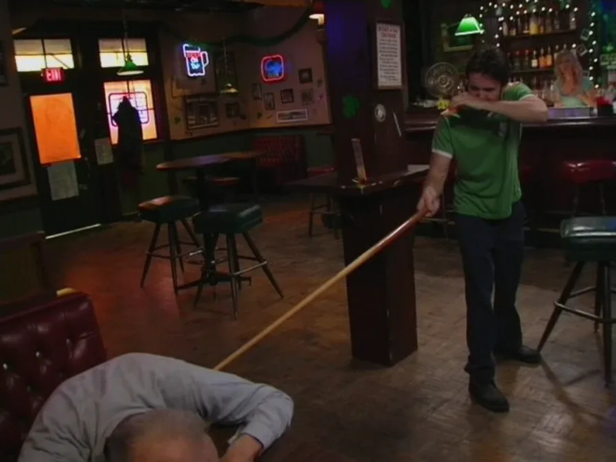Still from It's Always Sunny S01E06: Mac pokes the dead guy