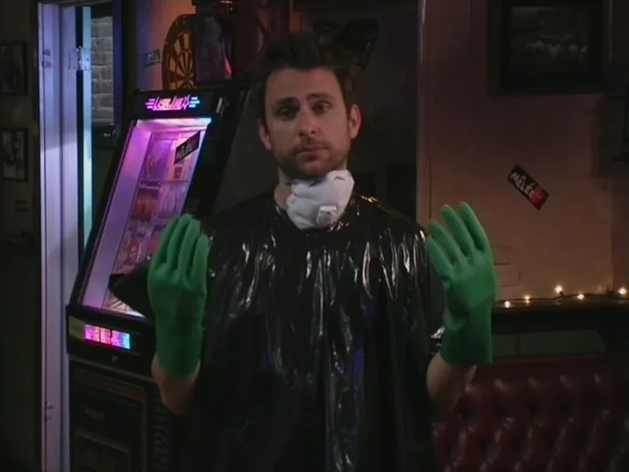Still from It's Always Sunny S01E06: Charlie in cleaning gear